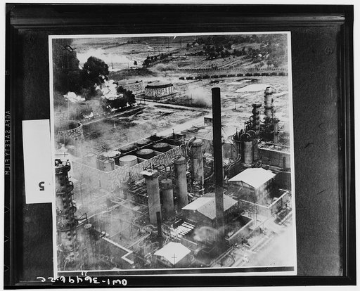 Ploesti, Romania. August 1, 1943. Oil storage tanks at the Columbia Aquila refinery burning after the raid of B-24 Liberator bombers of the United States Army Air Force. Some of the structures have been camouflaged