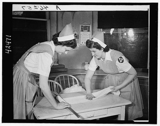 Red Cross nurses' aides preparing surgical bandages