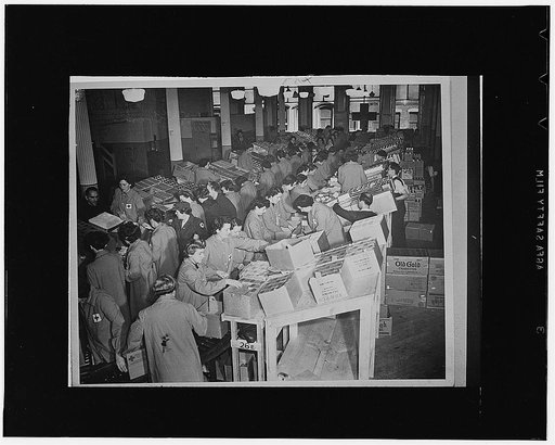 Red Cross workers packing boxes to go to the United States Armed Forces and prisoners of war