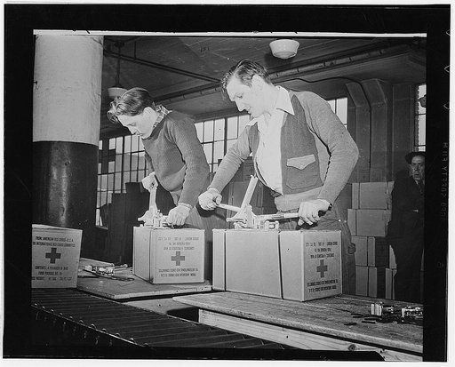 Working in daily squads of eighty, Red Cross women volunteers from all walks of life, can pack parcels at the rate of 2,000 an hour. The packages are destined for American and other Allied soldiers and sailors held in enemy prison camps