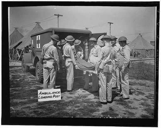 Dayton, Ohio. Men of the Army Air Forces medical services, learning how to remove a "casualty" to the ambulance post ready for a speedy trip to a waiting transport which will evacuate the wounded