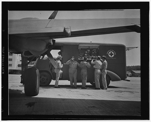 Washington, D.C. A new mobile canteen, recently received by the District of Columbia Red Cross, serving the armed forces around the district. Mrs. Harold Hoskins and her three assistants are feeding transient pilots and crews at a nearby Army airport