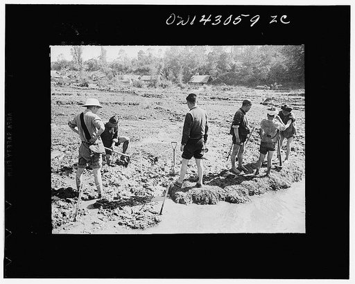 Public Health Service Investigation Commission to the China-Burma highway, Chefang (vicinity), China. Staking out and starting a seepage ditch in the Old Fort area