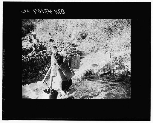 Public Health Service Investigation Commission to the China-Burma Highway, Chefang, China. Shan mother at a spring