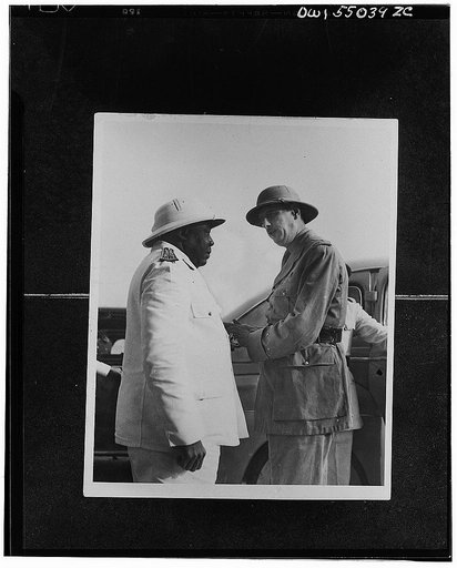 Charles de Gaulle, chief of the Free France, is welcomed to Chad by Govenor-General Eboue of Free French Africa. Governor-General Eboue, a native of French Guinea, was the first Negro colonial governor in Africa. As governor of the Chad colony, he was the first African leader to rally to the Free Fr