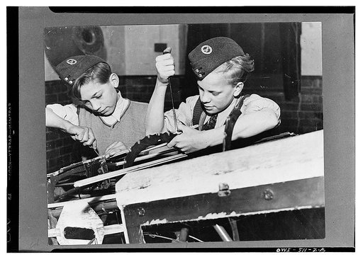 London (vicinity), England. Two members of the A.T.C. preparing to enter the Air Force working on an airframe