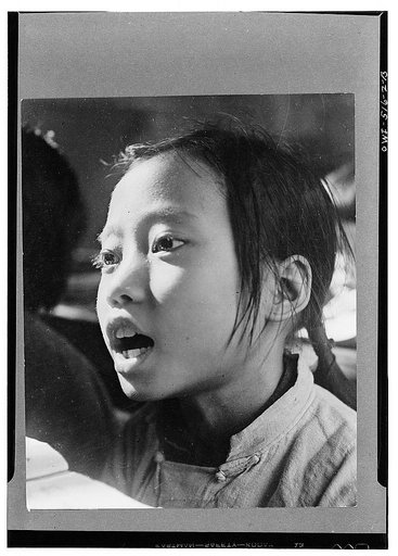 Chungking, China. A schoolgirl. In the municipality of Chungking there are 186 primary schools, 31 central and 155 public schools. 38,900 children in Chungking attend public school