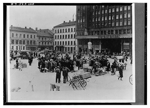 Oslo, Norway. People waiting in order to buy their ration of fruit and vegetables on Youngstorget market place