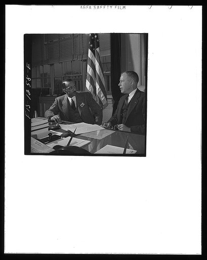 Washington, D.C. William H. Hastie, civilian aide to the Secretary of War, in conference with Undersecretary of War Patterson