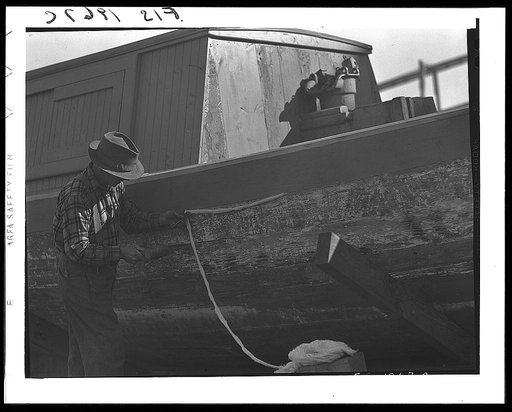 Provincetown, Massachusetts. Portuguese workmen caulking a hull