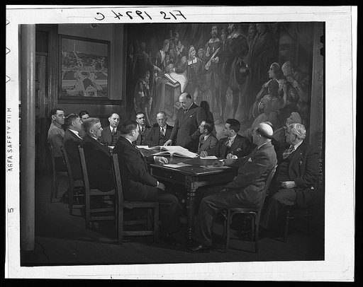 Provincetown, Massachusetts. City fathers of Provincetown, all of Portuguese descent, gathered in council, before a painting representing the signing of the Pilgrim compact in the bay of Provincetown upon the first landing of the Pilgrims on American soil