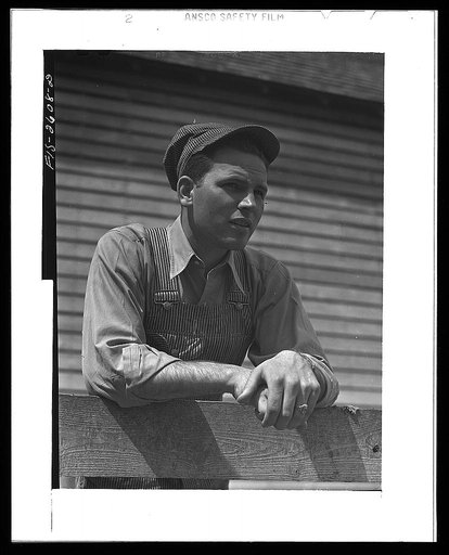 Gene Cooper, student at Iowa State College visits his family on their farm near Ames, Iowa