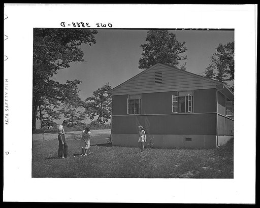 Sheffield, Alabama (Tennessee Valley Authority (TVA)). Kenneth C. Hall and family play croquet outside their home built by the TVA