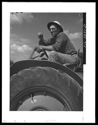 Lauderdale County, Alabama. Tennessee Valley Authority (TVA). Julien H. Chase uses machinery extensively on his 500 acre farm