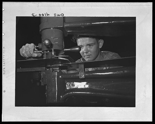 Knoxville, Tennessee (Tennessee Valley Authority (TVA)). Operating nibbler for sheet metal in training for war production at Stair Vocational High School