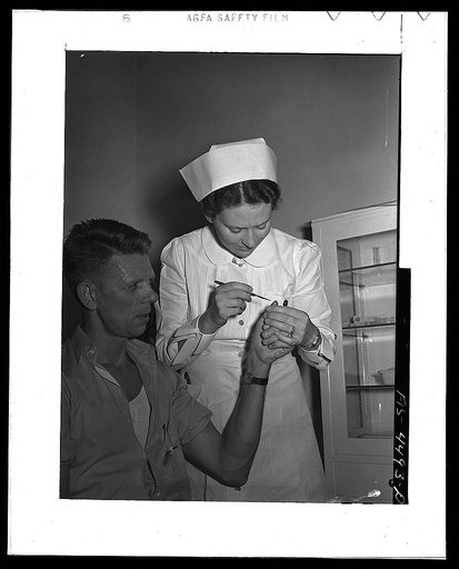 Sheffield, Alabama (Tennessee Valley Authority (TVA)). Hall receives first aid at aluminum plant where he works