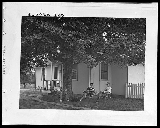 Florence, Alabama (Tennessee Valley Authority (TVA)). Gordon Williams, electrician at Wilson Dam, lives in this demountable prefabricated defense house at Florence, Alabama