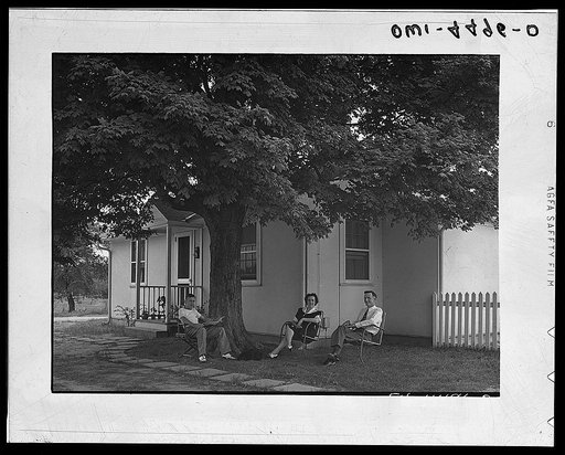 Florence, Alabama (Tennessee Valley Authority (TVA)). Gordon Williams, electrician at Wilson Dam, lives in this demountable prefabricated defense house at Florence, Alabama