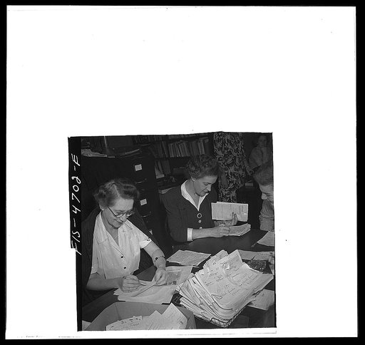 Washington, D.C. Stack of untranslated messages in the middle of the table at the Red Cross Foreign Inquiry Service