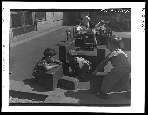Queens, New York. Nursery school at the Queensbridge housing project. Children playing with blocks