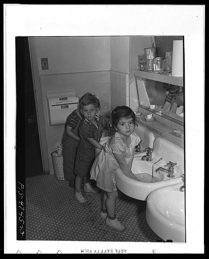 Queens, New York. Nursery school at the Queensbridge housing project. Children washing before lunch