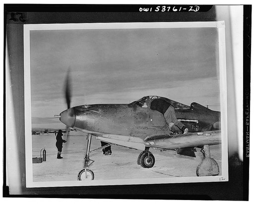 Nome, Alaska (?). Checking the radio of a P-39 plane before taking off for Siberia