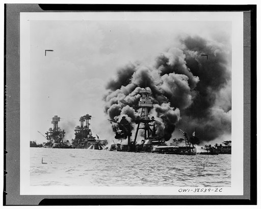 Stricken from the air. Testifying to the extent of the Japanese sneak attacks are these three stricken U.S. battleships. Left to right: U.S.S. West Virginia, severely damaged; U.S.S. Tennessee, damaged; and U.S.S. Arizona, sunk