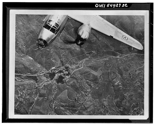 French airmen hit a pinpoint target. Flying with the Mediterranean Allied Air Forces under the tri-color of France, the Frenchment split a vital rail bridge, 600 feet long and 15 feet wide, at the Piteccio viaduct in central Italy. On the wing of the American-made B-26 bomber may be seen the roundel