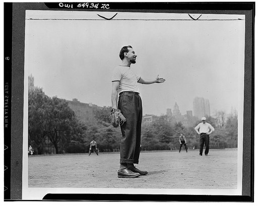Jose Ferrer playing softball with other members of Othello production, Central Park, New York City
