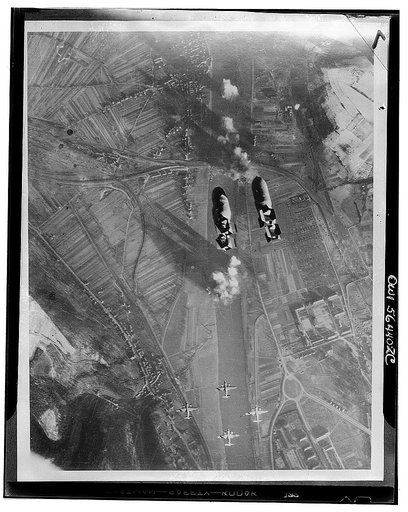 Untitled negative showing an attack of USAAF Martin B-26 Marauder bombers on the railroad bridge across the Moselle River at Trier-Pfalzel, Rhineland-Palatinate, Germany, Dec. 24, 1944