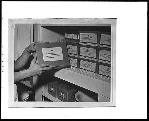 Hoffman, N.C. Boxes of dried blood plasma stored in a cabinet inside the operating tent which was set up during the Carolina maneuvers