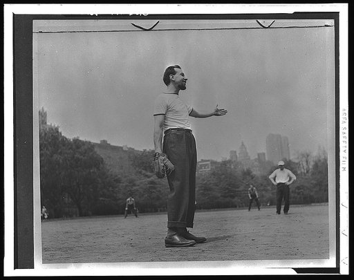 Jose Ferrer playing softball with other members of Othello production, Central Park, New York City
