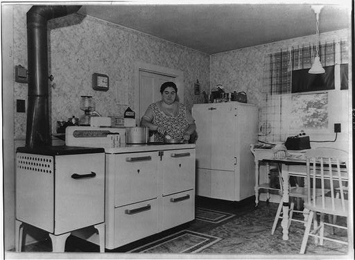 Portrait of America. No. 36. Rural electrification in the U.S. The electric range or stove in this American farm kitchen eliminates the need of building fires, carrying fuel and emptying ashes, thus allowing the housewife at least ten more hours per month for other tasks. Food for farm workers is co