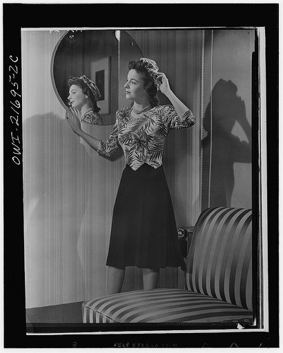Cynthia's complete dress spells style plus conservation. By obtaining best quality for least money, Cynthia practices one important war saving: quality wears longer. To twist a turban, Cynthia bought an extra half-yard of material; thus she has a complete costume from a minimum of material. With cha