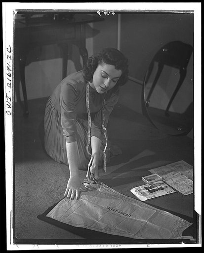 Material from last year's garment fashions the skirt of Cynthia's dress. By making some of the clothes for herself and her family, a woman can fully utilize all leftovers. To conserve fabric, old garments should be re-made when not worn out. Mothers with young children "cut down" discarded adult coa