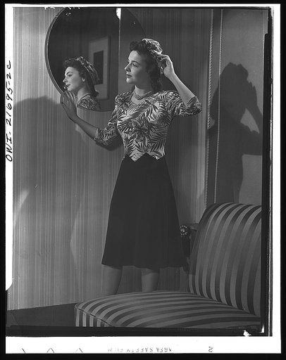 Cynthia's complete dress spells style plus conservation. By obtaining best quality for least money, Cynthia practices one important war saving: quality wears longer. To twist a turban, Cynthia bought an extra half-yard of material; thus she has a complete costume from a minimum of material. With cha