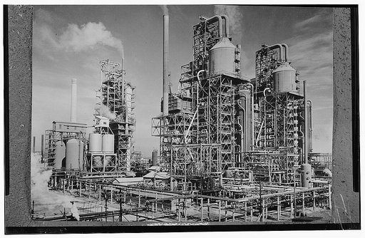 America's petroleum industries pour out fuel and lubricants for the United Nations. These three new catalytic oil "cracking" units are turning out gasoline for the new machines of war at the plant of a large U.S. refining company in the southern U.S. state of Louisiana. In the eight years of the dev