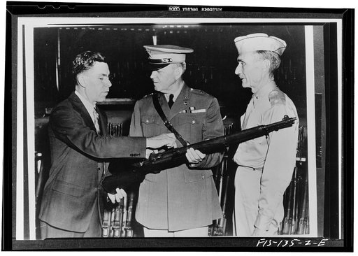 Springfield, Massachusetts. John C. Garand, inventor of the Garand rifle, pointing out some of the features of the rifle to Major General Charles M. Wesson during the general's visit to the Springfield arsenal. At right is Brigadier General Gilbert H. Stewart, commanding officer of the arsenal