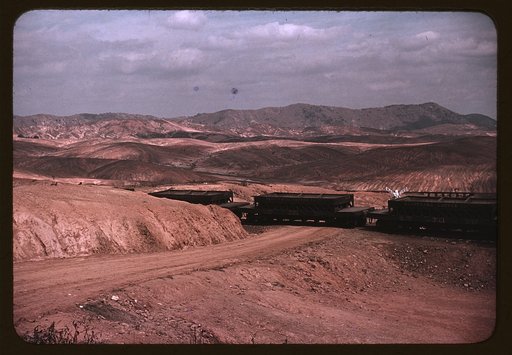 A train bringing copper ore out of the mine, Ducktown, Tenn. Fumes from smelting copper for sulfuric acid have destroyed all vegetation and eroded the land