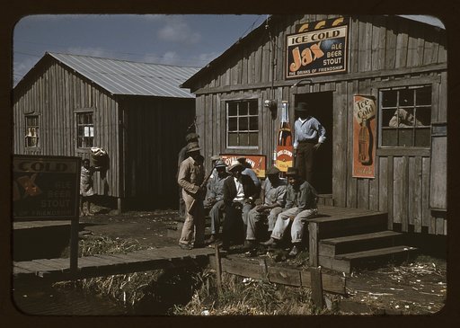 Migratory laborers outside of a "juke joint" during a slack season, Belle Glade, Fla.