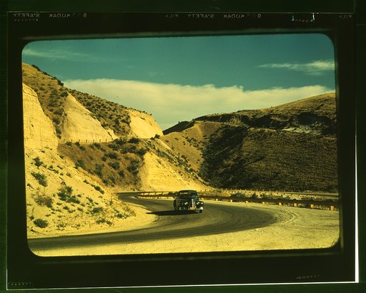 Road cut into the barren hills which lead into Emmett, Idaho