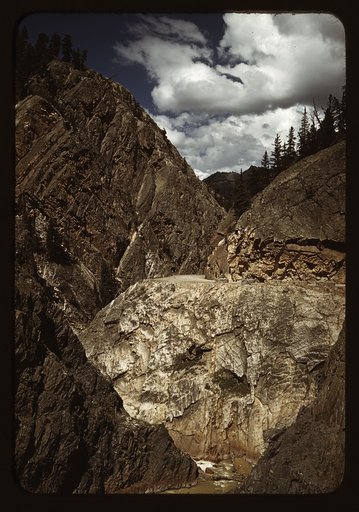 Million dollar highway [U.S. 550] is cut through massive rocks in Ouray County, Colorado