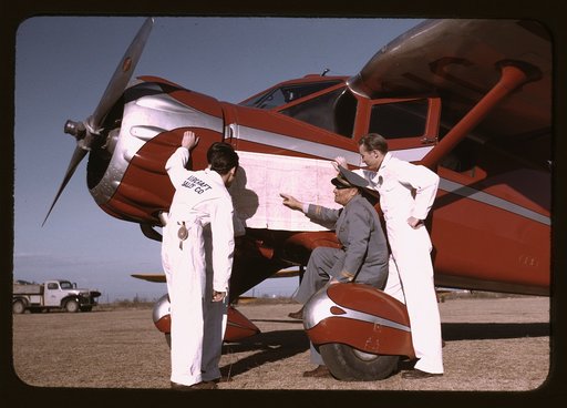 Instructor and students studying a map, Meacham Field, Fort Worth, Tex.
