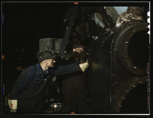 Working on the cylinder of a locomotive at the C & NW RR [i.e. Chicago and North Western railroad], 40th Street shops, Chicago, Ill.