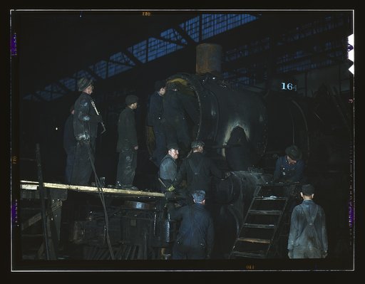 Working on a locomotive at the 40th Street shop of the C & NW RR [i.e. Chicago and North Western railroad], Chicago, Ill.