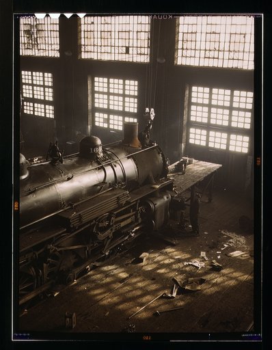 C & NW RR [i.e. Chicago and North Western railroad], working on a locomotive at the 40th Street railroad shops, Chicago, Ill.