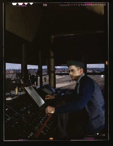 C&NWRR [i.e. Chicago and North Western railroad], towerman R.W. Mayberry of Elmhurst, Ill., at the Proviso yard. He operates a set of retarders and switches at the hump, Melrose Park (near Chicago), Ill.