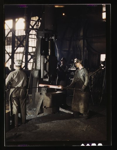 Working with a small steam drop hammer at the blacksmith shop in the Santa Fe R.R. shops, Topeka, Kansas