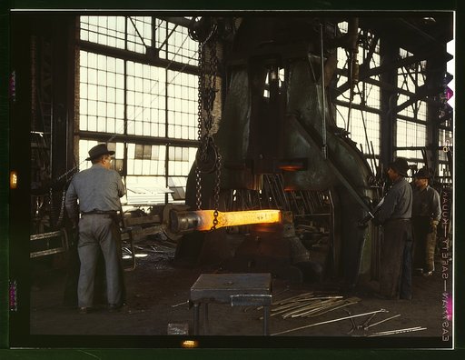 Hammering out a draw bar on the steam drop hammer in the blacksmith shop, Santa Fe R.R. shops, Albuquerque, N[ew] Mex[ico)