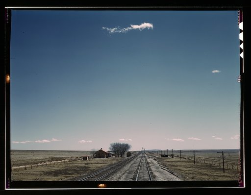 Passing a section house along the Atchison, Topeka, and Santa Fe railroad, Encino vicinity, New Mexico